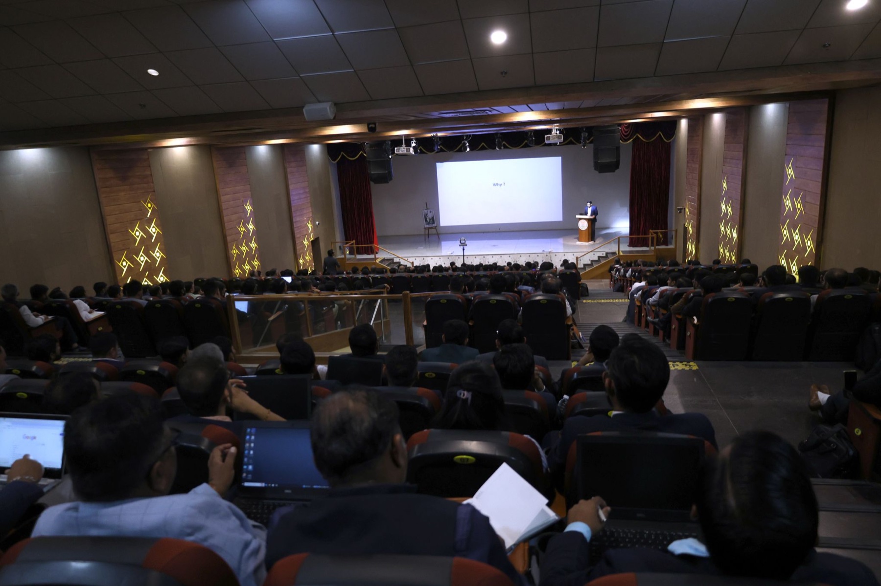 Upendrasinh Zala speaking on stage