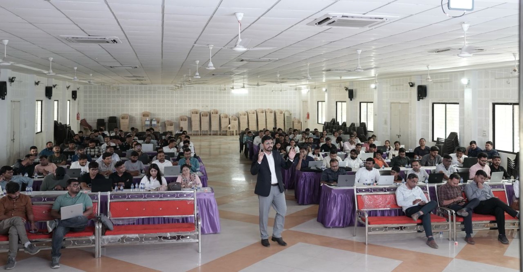 Upendrasinh Zala speaking on stage